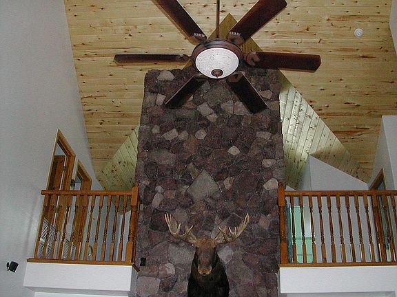 2 story stone fireplace