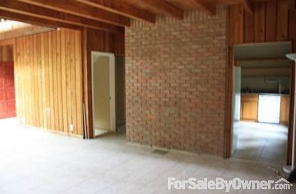 Living Rm & Dinning room
						:
						The Living & Dining rooms area with a brick wall separating kitchen.