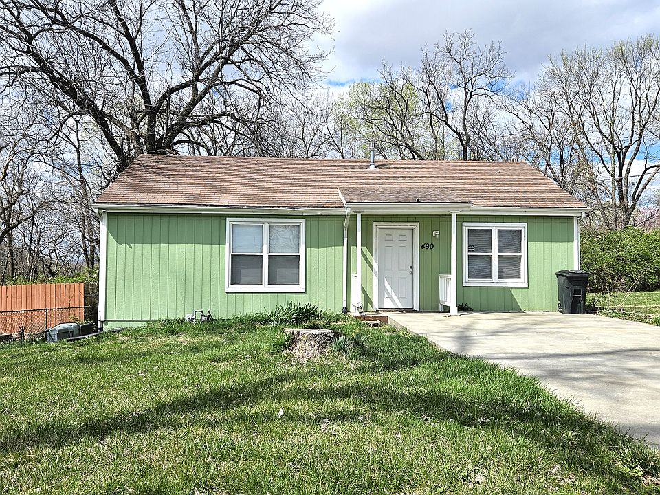 Front of home with double wide driveway for parking