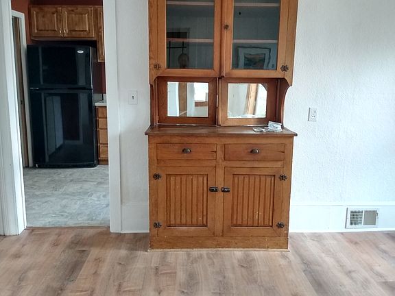 From dining room, looking toward kitchen. Original 1920 hutch opens to both dining room and kitchen.
