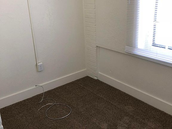 Smaller front bedroom can be used as a dressing room, vanity