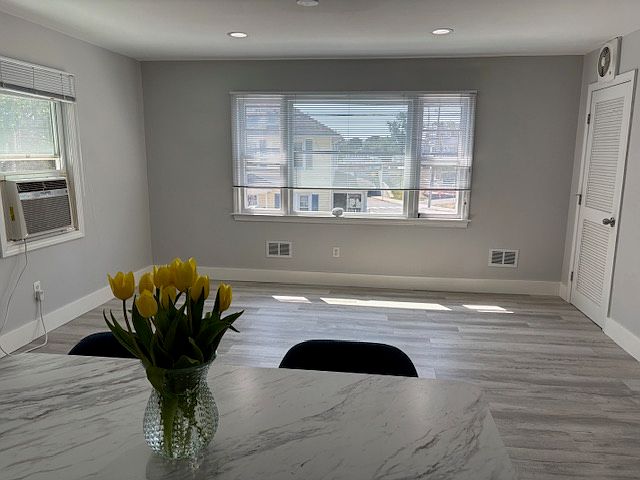 Kitchen Island opens to sunny living room