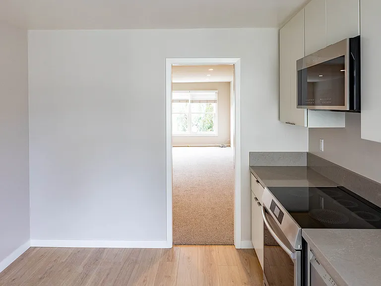 Space for table & chairs in the kitchen (in the corner near the door to dining/living room)