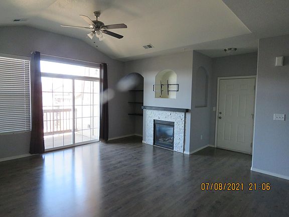 Enter the home into the living room. With its vaulted ceilings, the room gives the feeling of a Great Room