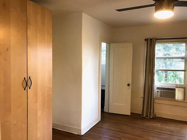 Bedroom 1 closets & partial window view