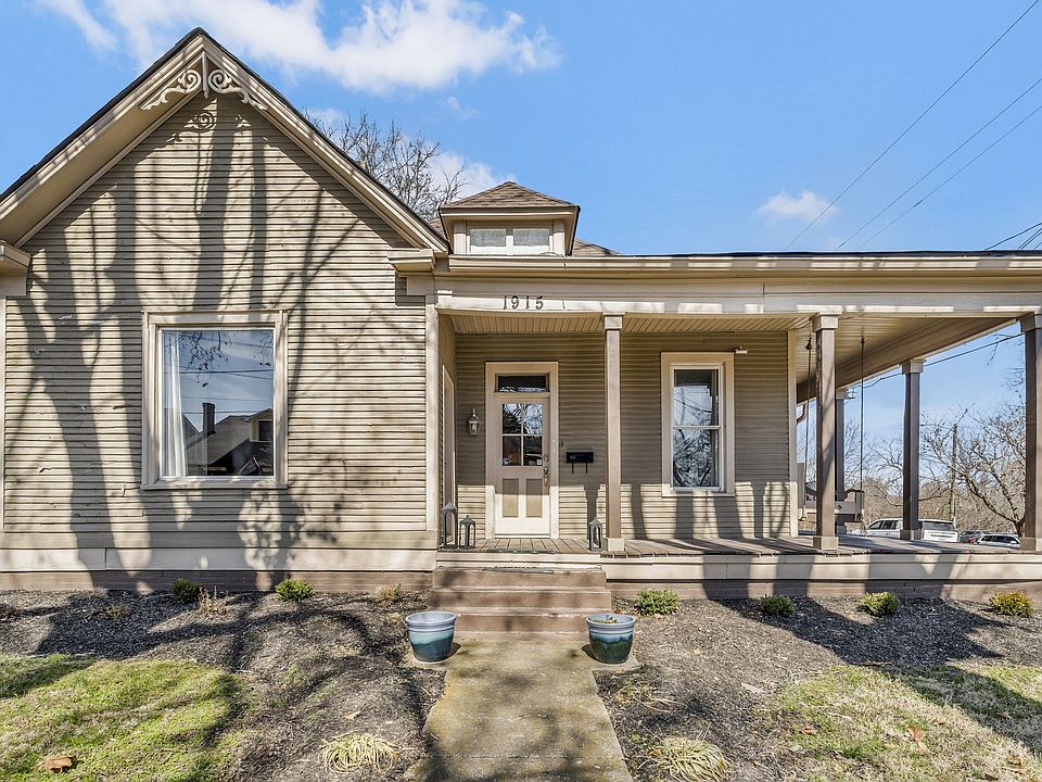 Welcome to East Nashville. Front entrace with wrap-around porch with swing.
