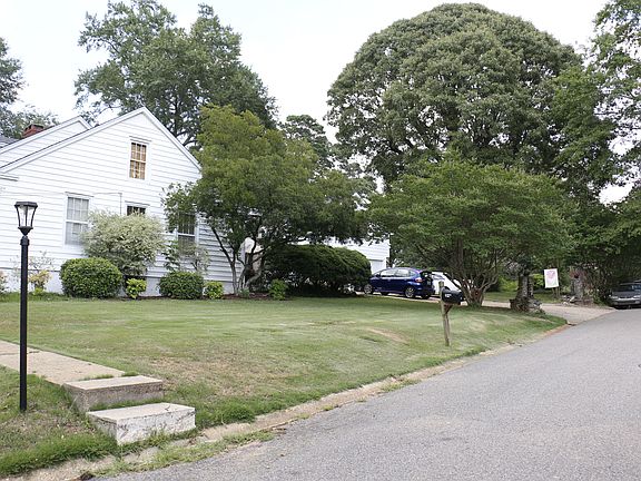 side yard - driveway accommodates five vehicles without blocking anyone in, but there's also lots of street side parking for your guests.