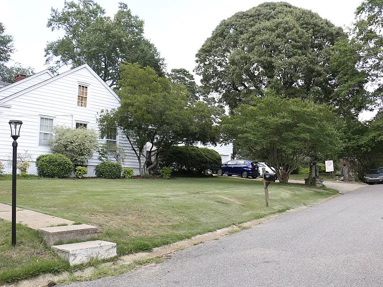 side yard - driveway accommodates five vehicles without blocking anyone in, but there's also lots of street side parking for your guests.