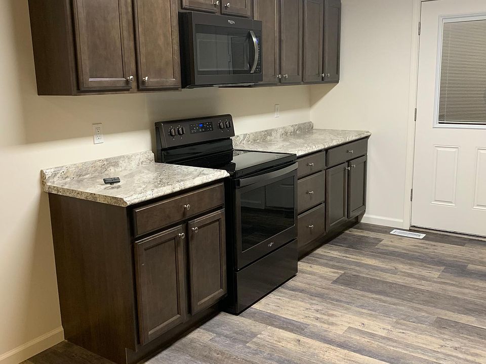 Kitchen with black stainless steel appliances included.