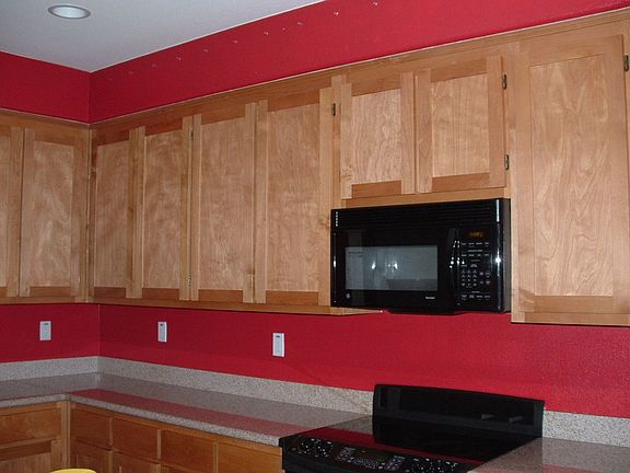 Open Kitche with island and black appliances