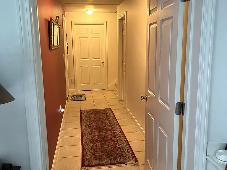 Hallway to entrance to apartment