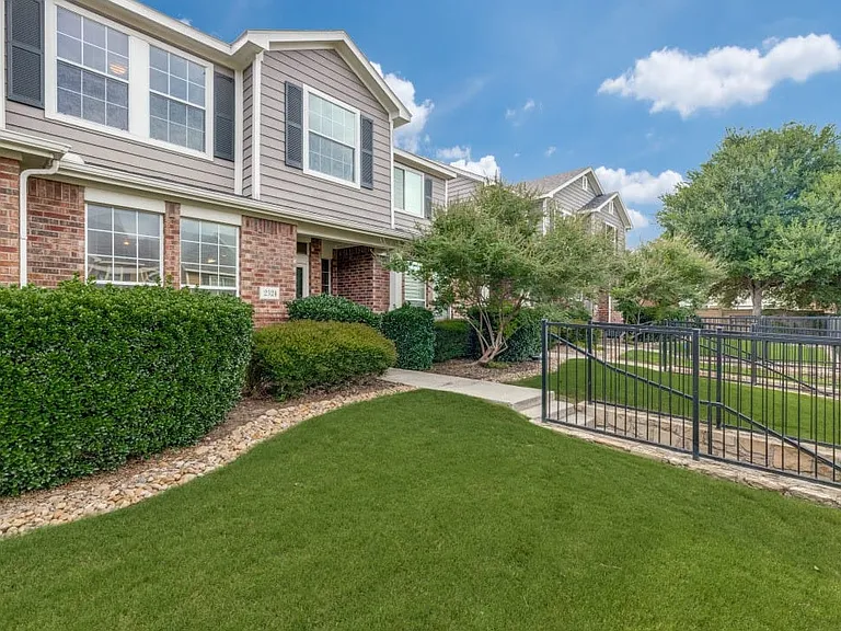 Beautifully landscaped entry to home.