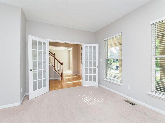 French doors allow this room to be so versatile! Den, office, music room...you choose!