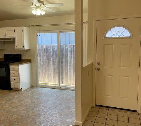 Front door and sliding glass doors in kitchen