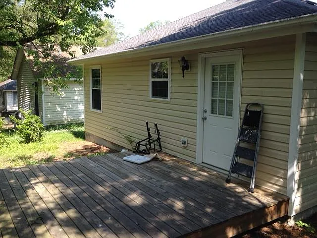 Back of house with deck