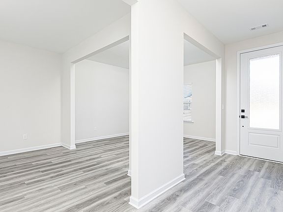 Move freely between the front flex room and the dining room