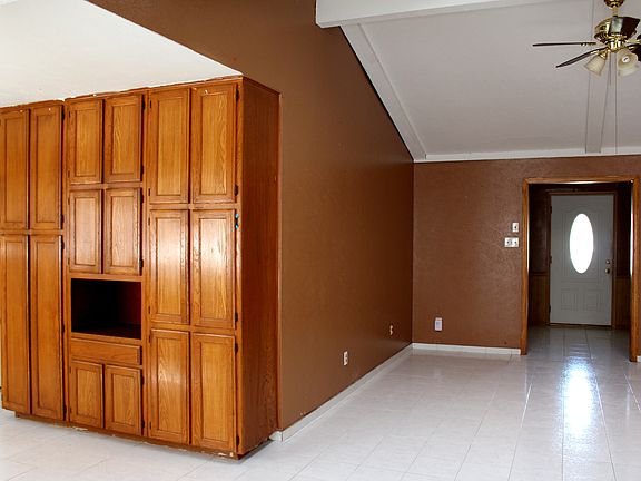 Spacious living room leading to kitchen