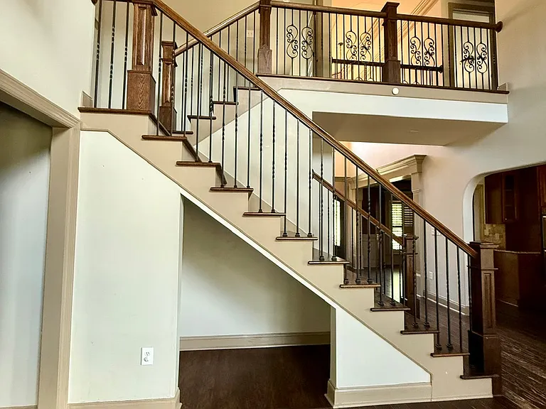 Open floor plan with beautiful stairs and cat walk