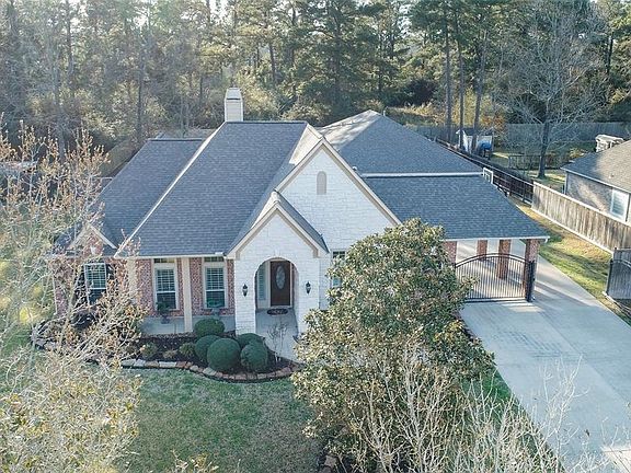 Beautiful one story has private gated driveway and detached 3.5 car garage behind the home.
