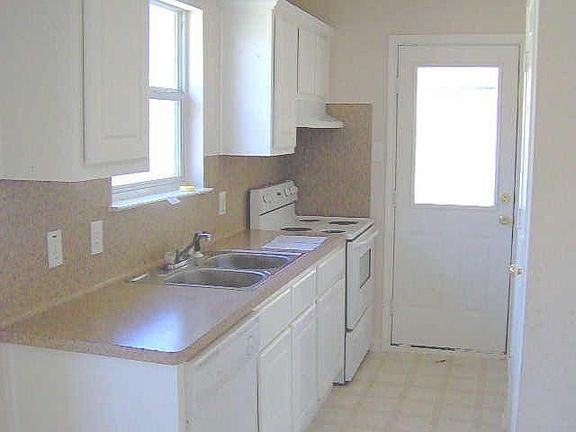 long kitchen with covered patio access