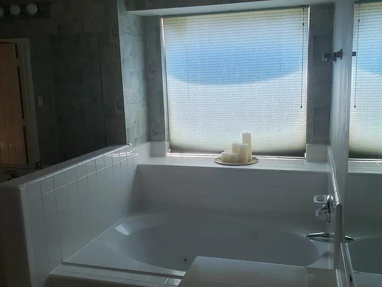 Floor 2 - Master bathroom with big bathtub, two sinks, new commode and three closets