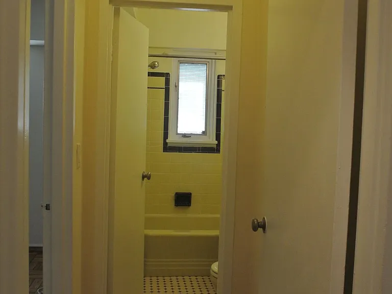 Hallway from entrance towards bedroom and bathroom
