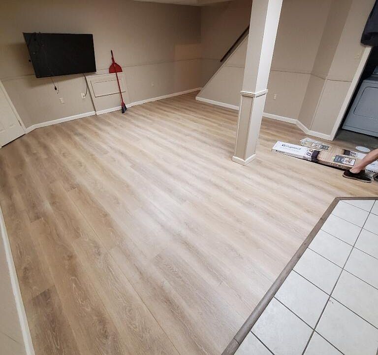 completed basement, new floors, painted for brightness, tv stays