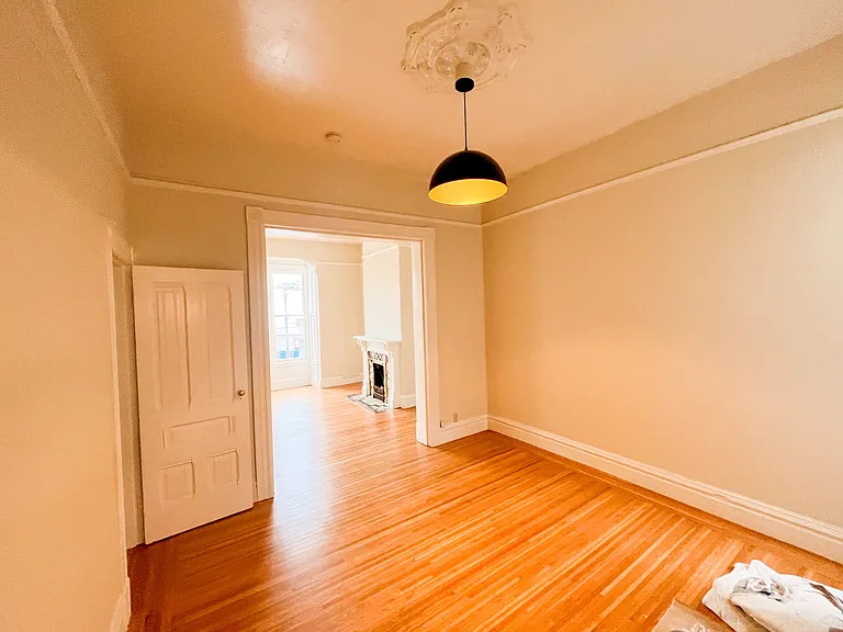 BEDROOM LOOKING TOWARDS LIVING ROOM