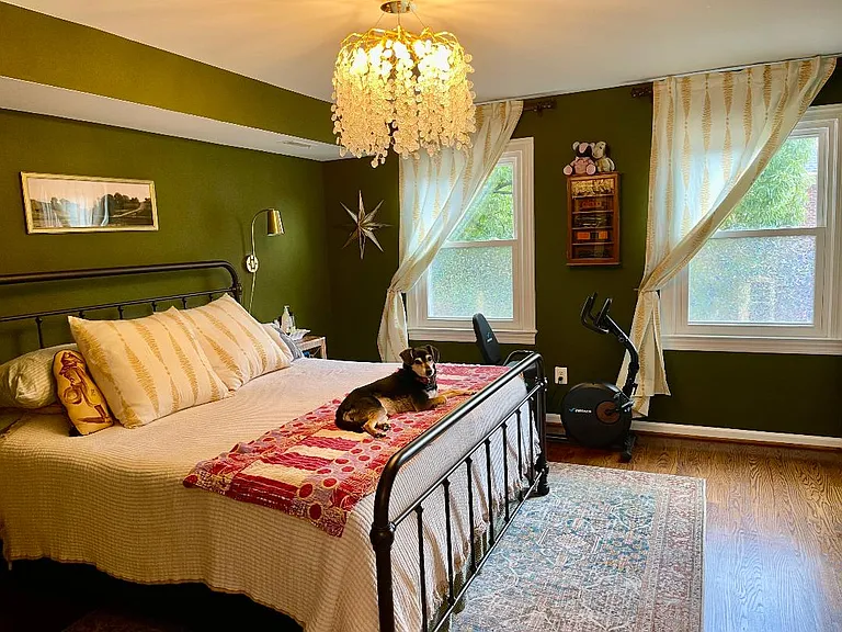 Comfortable and warm primary bedroom with a marble 3/4 en suite bath attached. This room has two large his and hers closets.