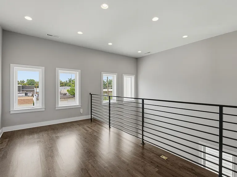 2nd level over looking the family room below, large windows facing the back of the home & lots of light! The perfect spot for an office, reading area, sitting area or whatever you may need.