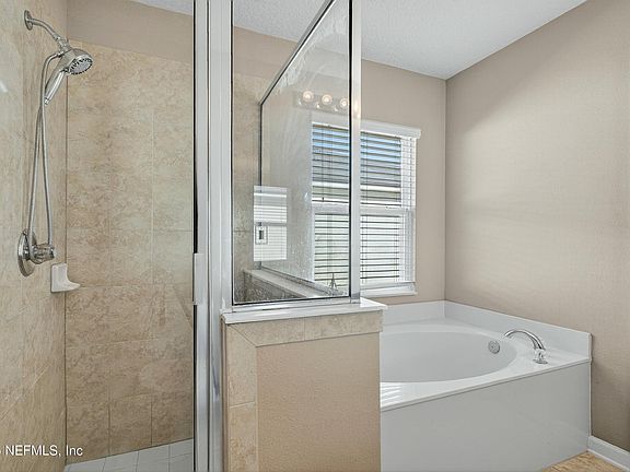 masteroom bath: stand up shower and bath tub with double sink vanity