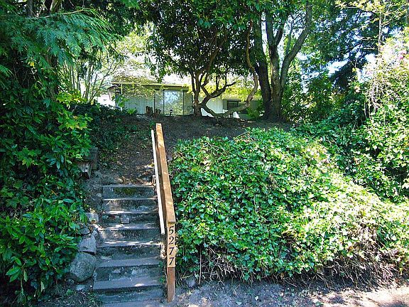 Home sits high above street.
