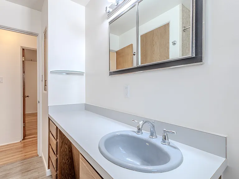 Large vanity with double mirror, lots of light and drawers for all your stuff.