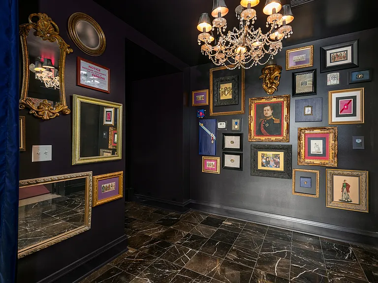 York House decorative lobby with eclectic framed art and vintage chandelier