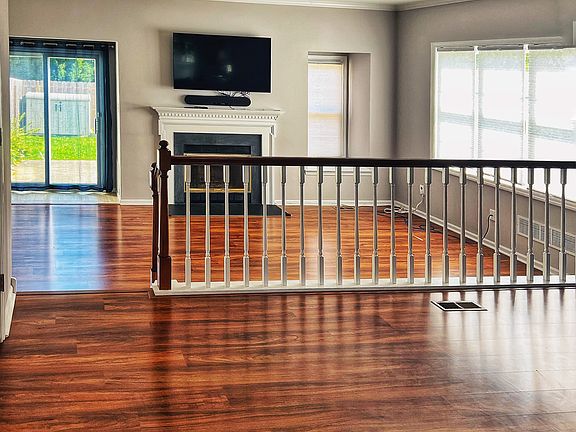 Living room and dining room with kitchen behind