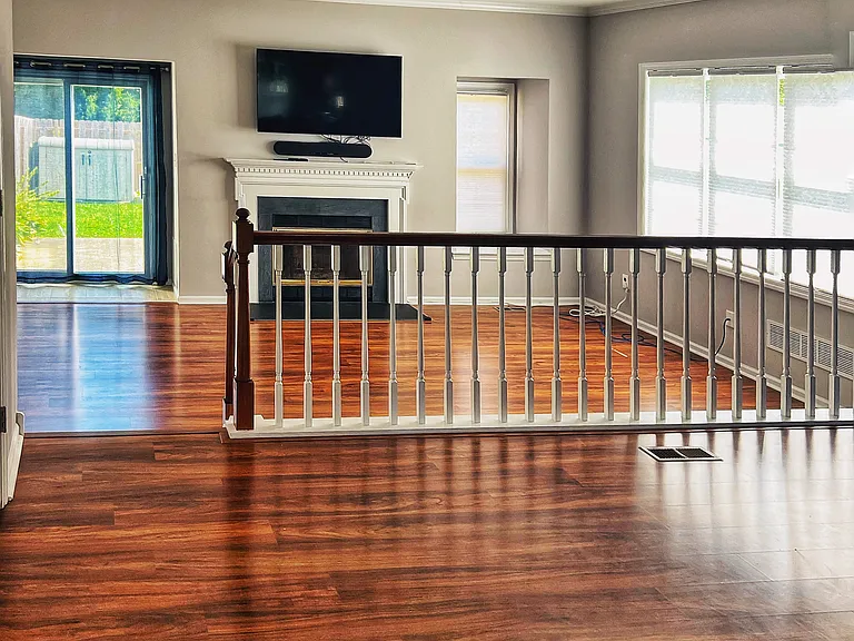 Living room and dining room with kitchen behind