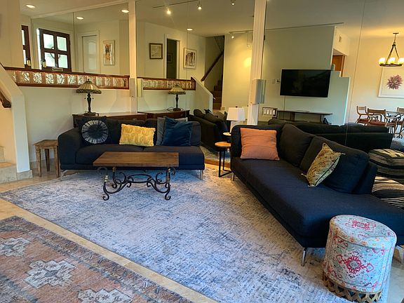 Living room. Garage door can be seen in the reflection next to the front door.