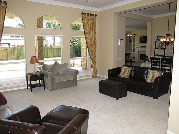 FORMAL LIVING WITH BEAUTIFUL WALL OF WINDOWS