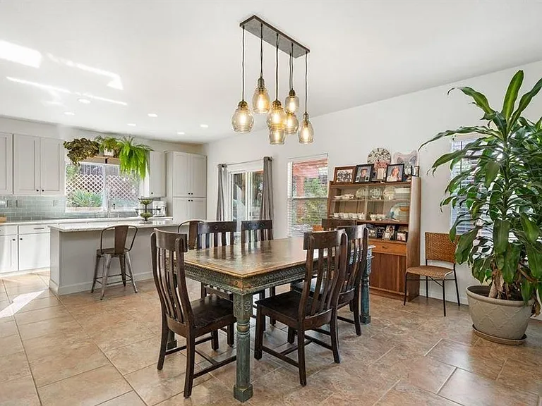 Kitchen and dining room. Sliding glass door to access backyard.