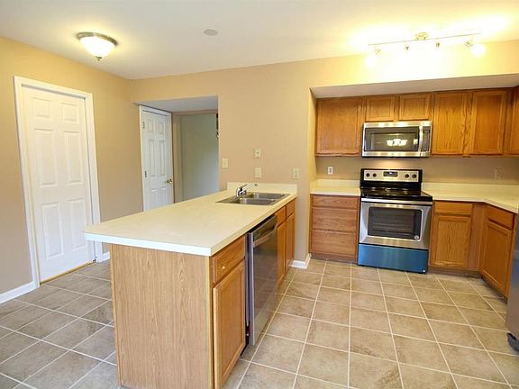 Kitchen & Bar with all Stainless Appliances.
