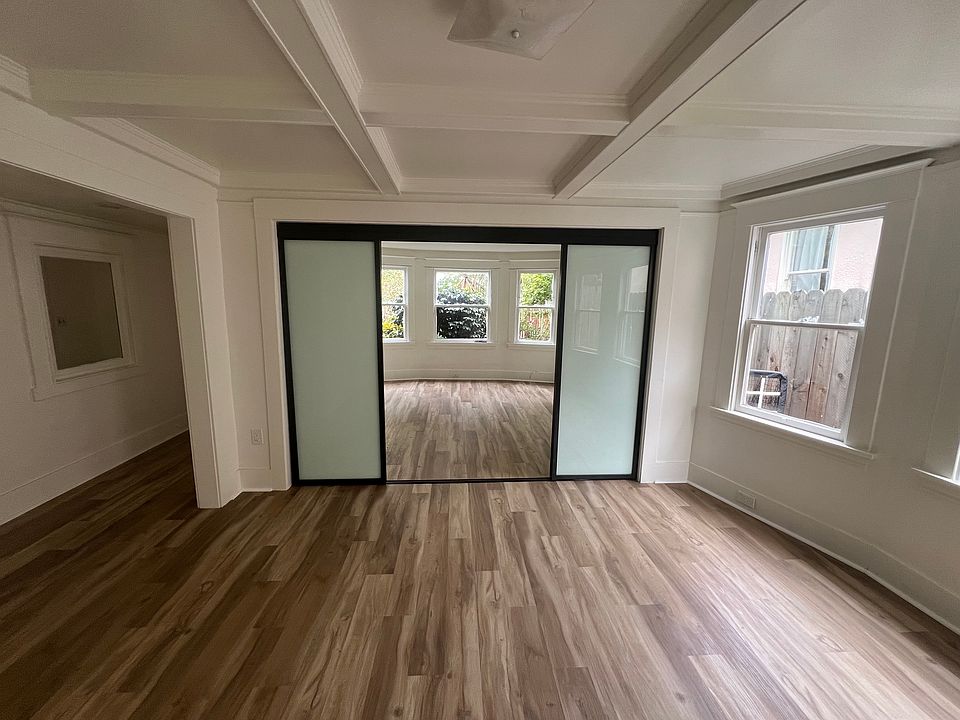 Living Room with view of sliding glass doors into Front Bedroom 1.