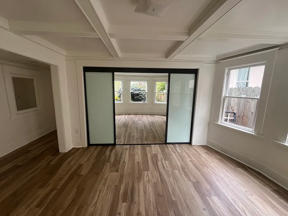 Living Room with view of sliding glass doors into Front Bedroom 1.