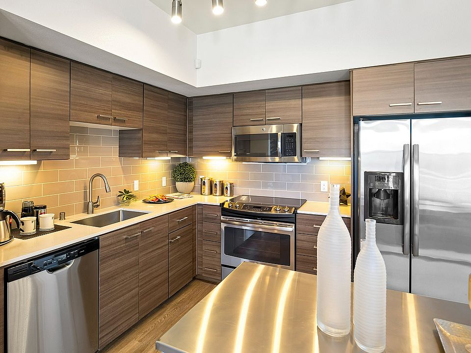 Modern kitchen with sleek wooden cabinetry in Tempo at Riverpark