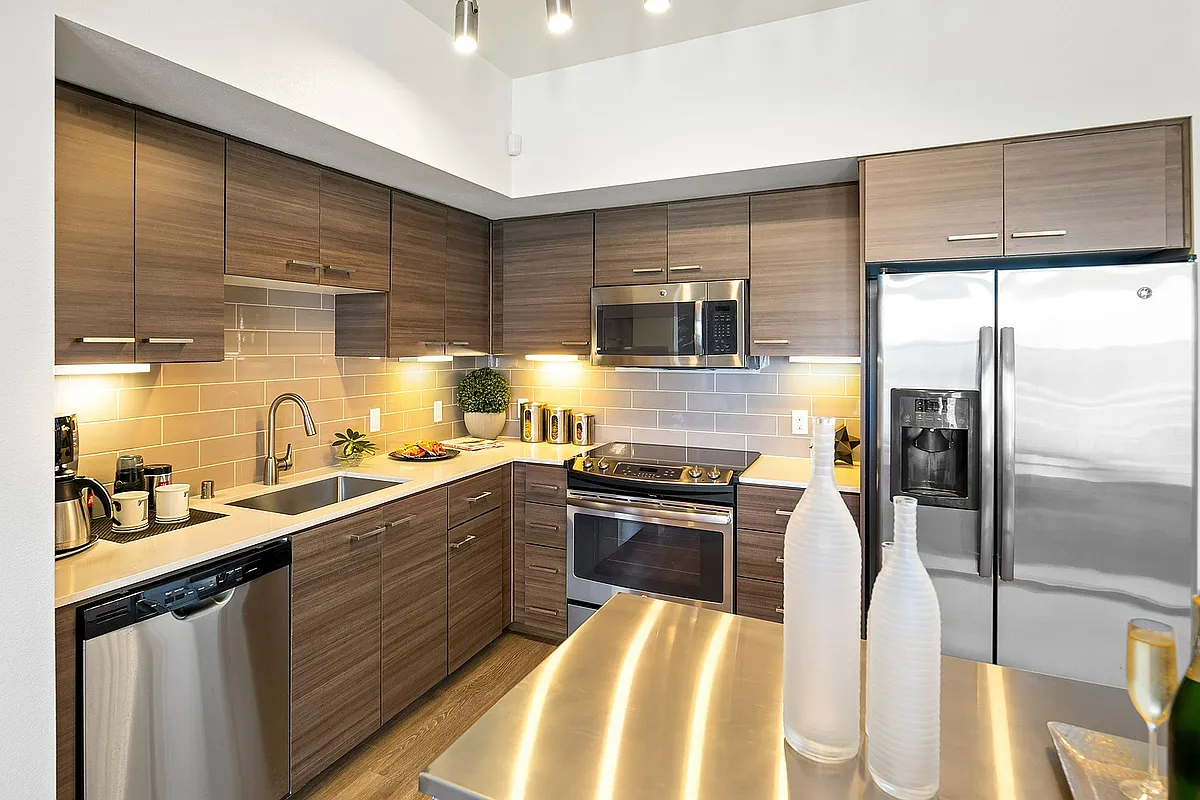 Modern kitchen with sleek wooden cabinetry in Tempo at Riverpark - Tempo Riverpark