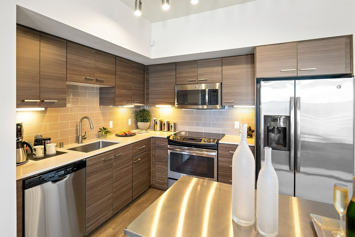 Modern kitchen with sleek wooden cabinetry in Tempo at Riverpark