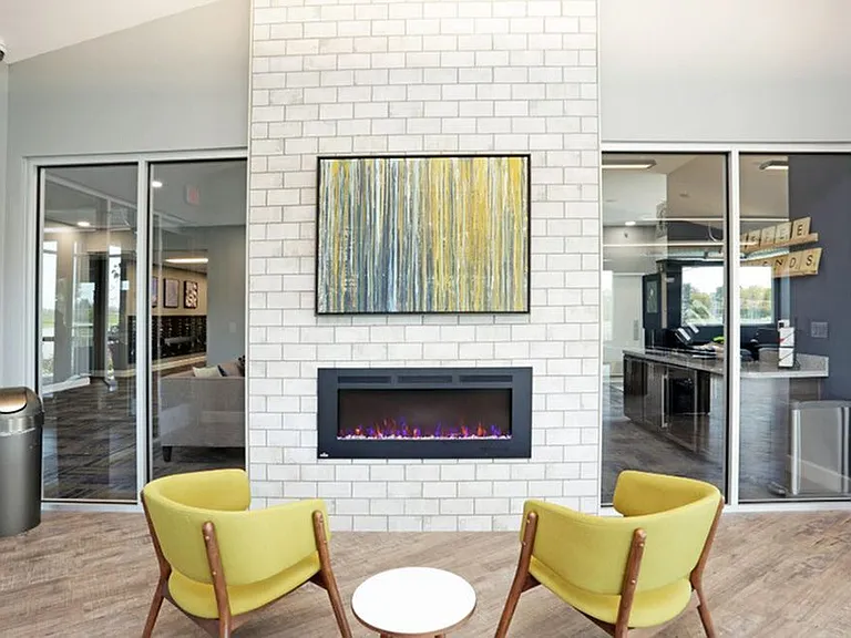 Cozy up next to the fireplace in the resident clubhouse.