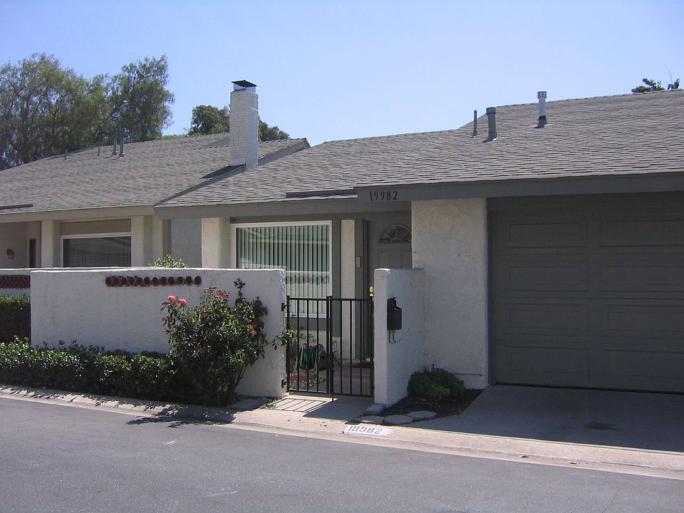 This detached condo has a two-car attached garage.  There are no shared walls.