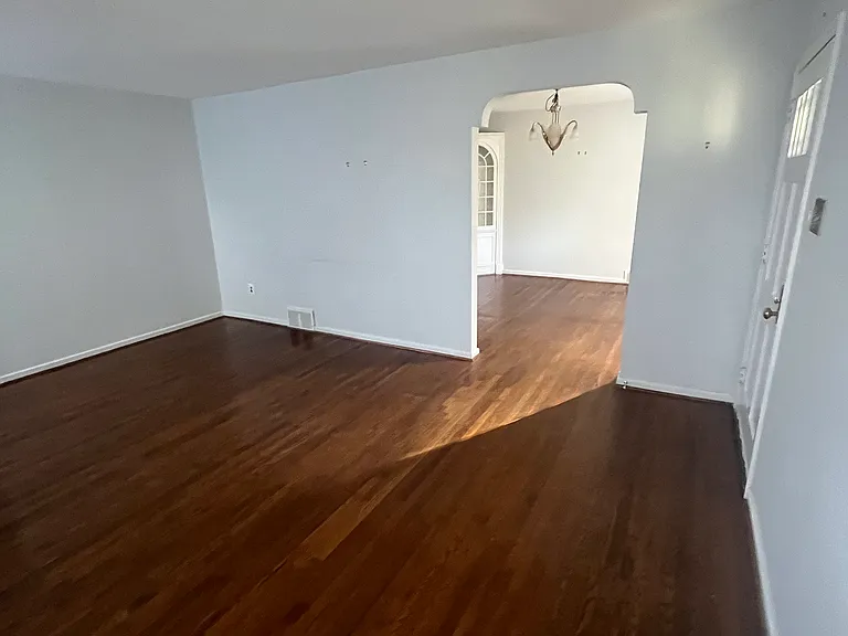 Living room going into the formal dining room/office
