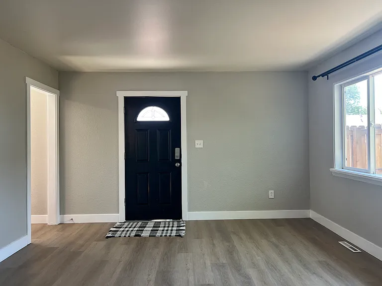 Dog owner dream: living room access to front door opens to secure, fenced front yard. Makes early morning outings a breeze!
