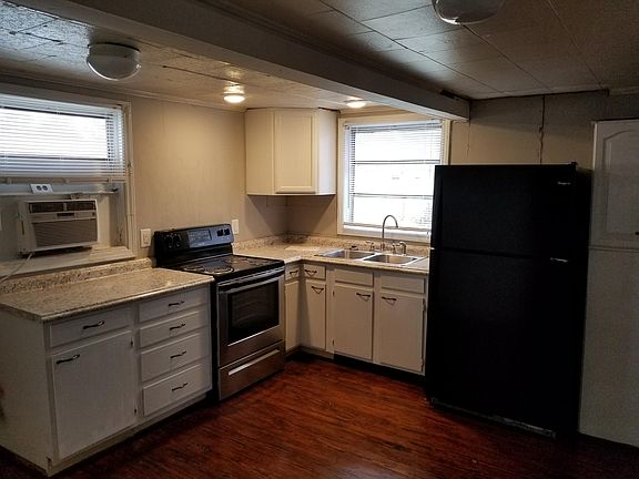 Large bright eat in kitchen, hard wood floors.